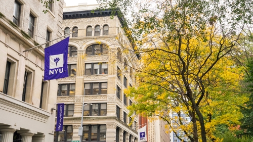 Pless Hall on Washington Square East surrounded by fall foliage