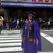 Portrait of Brianna Grand during graduation outside Raio City Music Hall.