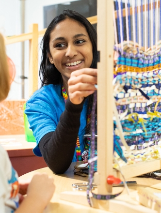 Art_ArtEd_21 Student with child and loom.